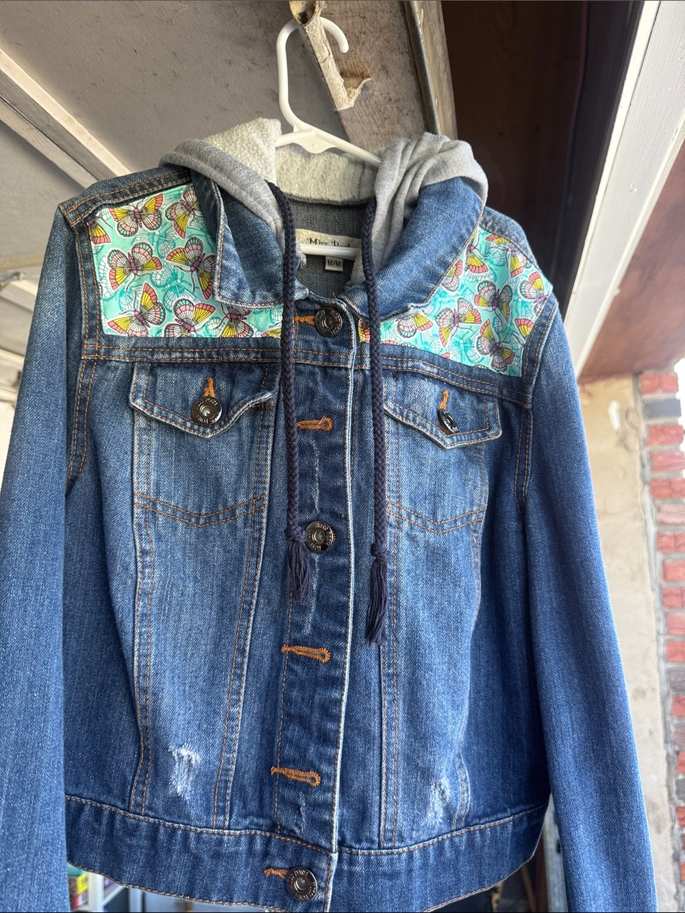 Distressed denim jacket.